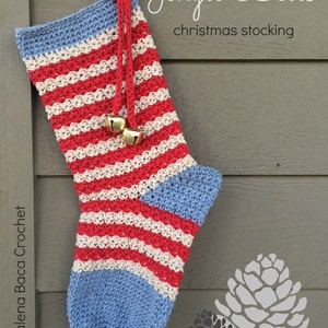 May include: A handmade crochet Christmas stocking with red, white, and blue stripes, and a blue cuff and toe. The stocking is decorated with gold bells and the text "Jingle Bells christmas stocking".