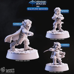 Puede incluir: Tres figuras en miniatura de Halfling Rogue. Una está en posición con una daga, otra afilando su daga y la tercera corriendo con una hoja. Cada figura está sobre una base de 25 mm, con alturas de 25 mm y 27 mm. El texto "Nightdagger Rogues" y "Halfling Rogues" es visible.