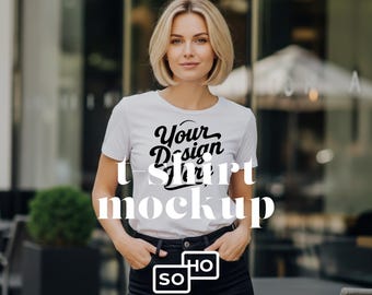 White T-Shirt Mockup Featuring Blonde Woman Standing in Front of a Restaurant: Lifestyle Apparel Mockup
