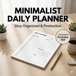 Peut inclure: Un agenda quotidien minimaliste blanc avec l'inscription "MINIMALIST DAILY PLANNER" en noir. L'agenda comprend des sections pour les horaires, les listes de tâches et le suivi des habitudes. Un stylo doré est posé à côté.