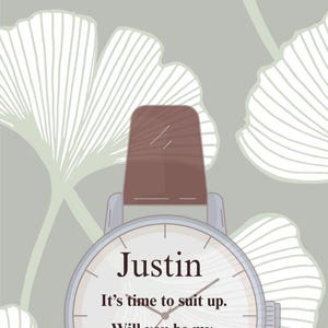 May include: A watch with a brown leather band and a white face. The watch face has the name "Justin" and the text "It's time to suit up. Will you be my Best Man?" on a background of a gray and white floral design.