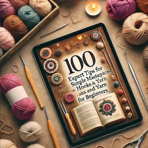 Könnte beinhalten: Ein Tablet zeigt ein Buchcover mit dem Titel "100 Expertentipps für einfache Meisterwerke mit Häkeln & Garn" und dem Untertitel "Alts und Garn für Anfänger". Das Cover zeigt eine Vielzahl von bunten gehäkelten Artikeln und Garnknäuel.