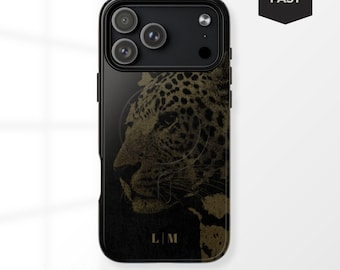 May include: Black phone case with a gold leopard design. The case has a glossy finish and features the initials "L | M" at the bottom. The case is labeled "MAGSAFE®" and has a "SHIPS FAST" graphic.