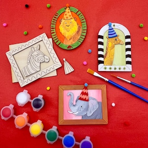 May include: A set of five wooden picture frames featuring animal illustrations, including a zebra, lion, giraffe, and elephant. The frames are ready to be painted with the included paint pots.