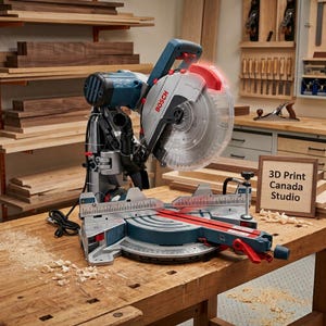 May include: A blue and silver Bosch mitre saw with a clear blade guard, a circular saw blade, and a red handle. The base features a metal scale with markings. A wooden sign nearby reads 3D Print Canada Studio, and the tool sits on a wooden workbench.