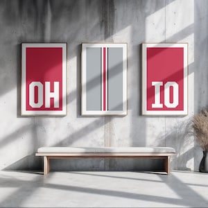 May include: Three framed prints with a red background and white text. The prints read "OH", "IO", and a gray stripe in the middle.