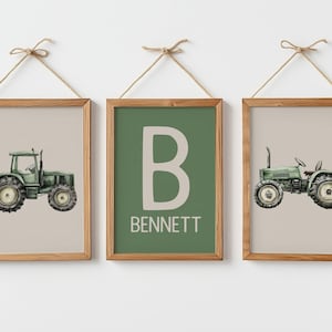 May include: Three framed prints with a farm theme. Two prints feature green tractors on a beige background. The centre print has a green background with the letter "B" and the name "BENNETT" in white. The frames are wood.