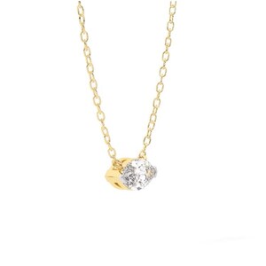 May include: A delicate gold necklace featuring a small, sparkling diamond pendant. The pendant is a square shape with a clear, faceted stone set in a gold and silver setting. The chain is a fine link design.