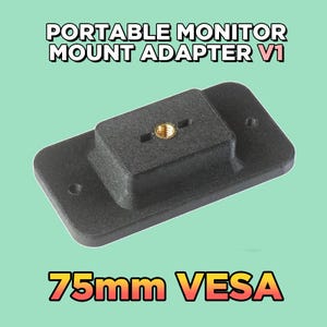 May include: A black rectangular portable monitor mount adapter V1 with a central brass-coloured threaded insert and two side mounting holes. The text PORTABLE MONITOR MOUNT ADAPTER V1 and 75mm VESA is displayed in the image for this hardware component.