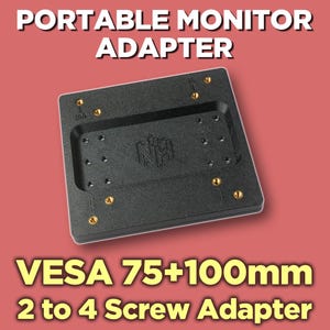 May include: A black rectangular portable monitor adapter featuring a central recessed area with a logo, multiple screw holes, and gold-coloured metal inserts. The text PORTABLE MONITOR ADAPTER and VESA 75+100mm 2 to 4 Screw Adapter are visible.