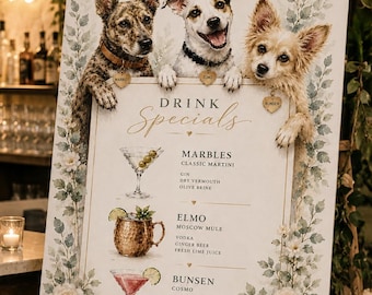 May include: A rectangular sign on a wooden easel featuring three illustrated dogs at the top and a drink menu titled Drink Specials. The menu lists Marbles, Elmo, and Bunsen with their ingredients, decorated with floral borders and the word cheers.