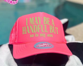 I May Be A Handful But so is my ass Trucker Hat