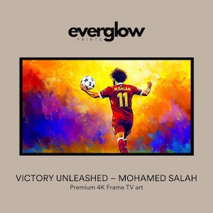 May include: A colorful painting of a soccer player in a red jersey with the name "M.SALAH" and the number "11" on the back. The player is kicking a soccer ball in a colorful, abstract background. The painting is titled "VICTORY UNLEASHED - MOHAMED SALAH" and is described as "Premium 4K Frame TV art".