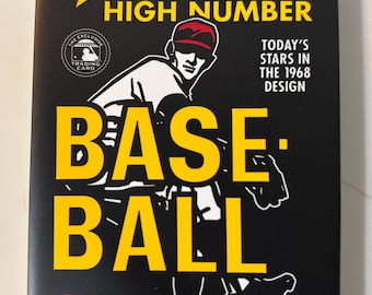 May include: A black Topps Heritage High Number baseball card pack from 2017. The pack features a yellow star and the word "HERITAGE" in yellow. The word "BASEBALL" is in large yellow letters. The pack contains 9 cards.