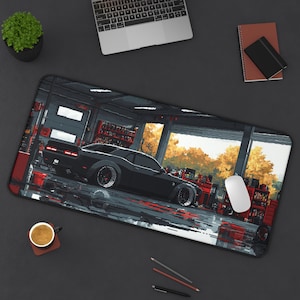 May include: A black Dodge Challenger muscle car parked in a garage with a view of trees and a sunset through the open garage door. The car has red brake calipers and black wheels.