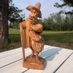 Hand-Carved Wooden Panhandler Figurine: Folk Art Sculpture