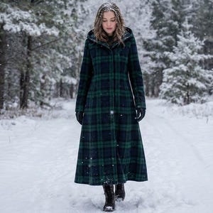 May include: A long, hooded coat in a green and navy plaid pattern. The coat is worn in a snowy forest setting. The coat has a button-up front and is paired with black gloves and boots. The coat is a winter outerwear garment.