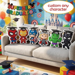 May include: Superhero graduation-themed pillows featuring various characters, each wearing a graduation cap. The pillows are arranged on a sofa, with balloons and graduation decorations in the background. Text on the pillows includes names like David, Leo, Ryan, Liam, John, and Mark.