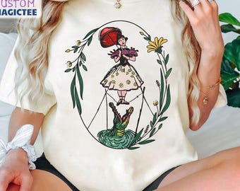 Maglietta "La casa dei fantasmi", T-shirt "Lady On Tightrope Girl" con colori floreali, T-shirt "Gita in famiglia Disney 2025", Maglietta "Il compleanno di Walt Disney"