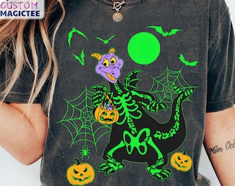 May include: Dark grey t-shirt with a Halloween dragon design. The black dragon has a green skeleton overlay, holding a pumpkin basket. Green bats, spiderwebs, and pumpkins complete the spooky design. The shirt has the text "Custom Magictee".