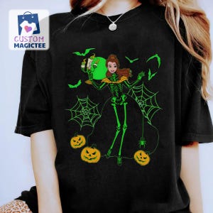 May include: Black t-shirt featuring a Halloween-themed graphic. The design includes a green skeleton, bats, spiderwebs, and jack-o'-lanterns. The graphic also features a cartoon character holding a drink. The shirt has the text "CUSTOM MAGICTEE" in the upper left corner.