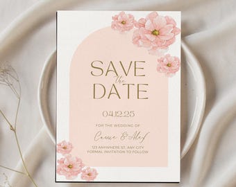 May include: A wedding save-the-date card with a blush pink arch design and floral accents. The card features the text "SAVE THE DATE" in gold lettering, along with the wedding date and couple's names. The card is surrounded by watercolor-style pink flowers.