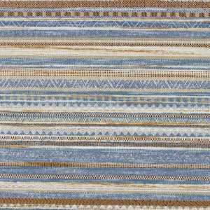 May include: A woven fabric featuring a repeating horizontal striped pattern in shades of blue, tan, and white. The design consists of alternating bands of solid colors, intricate geometric shapes, and textured lines across the entire surface.