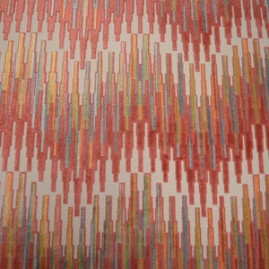 May include: Close-up of a fabric with a repeating pattern of vertical lines in shades of red, orange, yellow, and blue on a cream background. The design has a textured appearance, creating a visual depth.