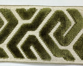 May include: Green velvet trim with a geometric pattern on a white background. The trim is approximately 1 inch wide.