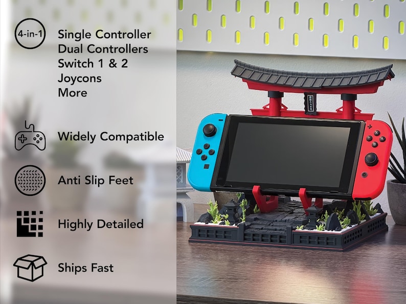 May include: A black, red, and blue Switch console stand with a Japanese Torii gate design. The stand holds the Switch console and Joy-Cons. Text on the side reads "4-in-1", "Widely Compatible", "Anti Slip Feet", and "Highly Detailed".