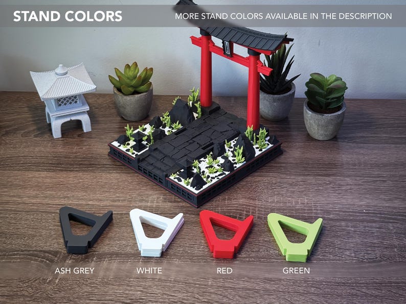 May include: A miniature Japanese Torii gate and pagoda model with a black base, red gate, and green accents. Four stand colors are displayed: ash grey, white, red, and green. The text "STAND COLORS" is visible.