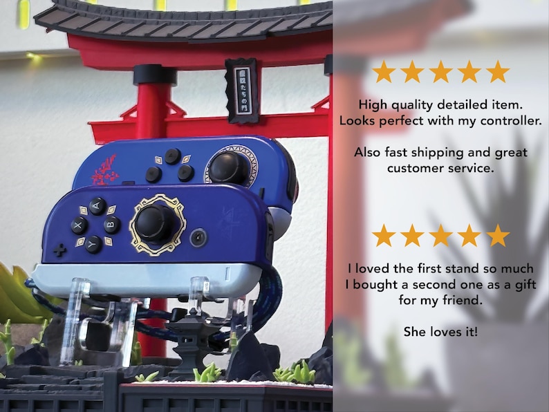 May include: A blue and gold controller stand with a Japanese Torii gate design. The stand holds two controllers, with a detailed design. The controllers are blue with black buttons and gold accents.