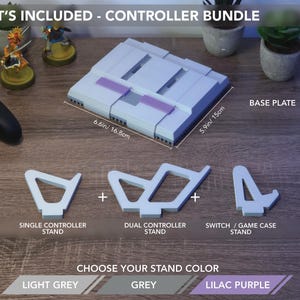 May include: A controller bundle includes a base plate (6.6in x 5.9in), single and dual controller stands, and a Switch/game case stand. Choose your stand color: light grey, grey, or lilac purple.