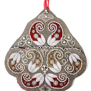 May include: An ornate, olive-green, teardrop-shaped pouch with intricate beadwork. The design features red, white, and brown paisley and leaf motifs, accented with white swirls and small pearl-like beads. A red ribbon loop is at the top.