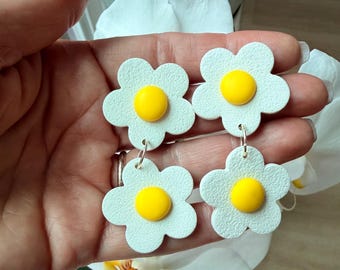 Bonitos pendientes florales hechos a mano.