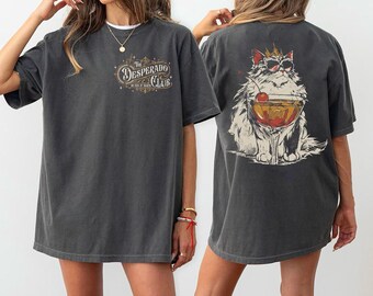 Camiseta Comfort Color Princess Donut Approved, Sudadera Desperado Club, Camiseta Mama Needs A Night Off, Camiseta Dungeon Crawler Carl