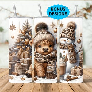May include: Three white stainless steel tumblers with winter-themed designs. One features a Christmas tree and gifts, another a calf in a hat and scarf, and the third a snowman. Each has a silver straw and the words "BONUS DESIGNS".