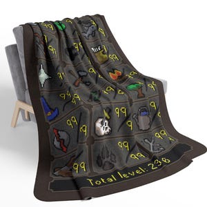 May include: A gray blanket draped over a chair, featuring a repeating pattern of pixelated icons and the number "99" in yellow. The blanket has a brown border and the text "Total level: 236".