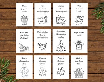 May include: A collection of twelve black and white Christmas activity cards. Each card features a different holiday-themed activity, such as making popcorn garland, decorating cookies, or singing carols. The cards are arranged on a wooden surface.