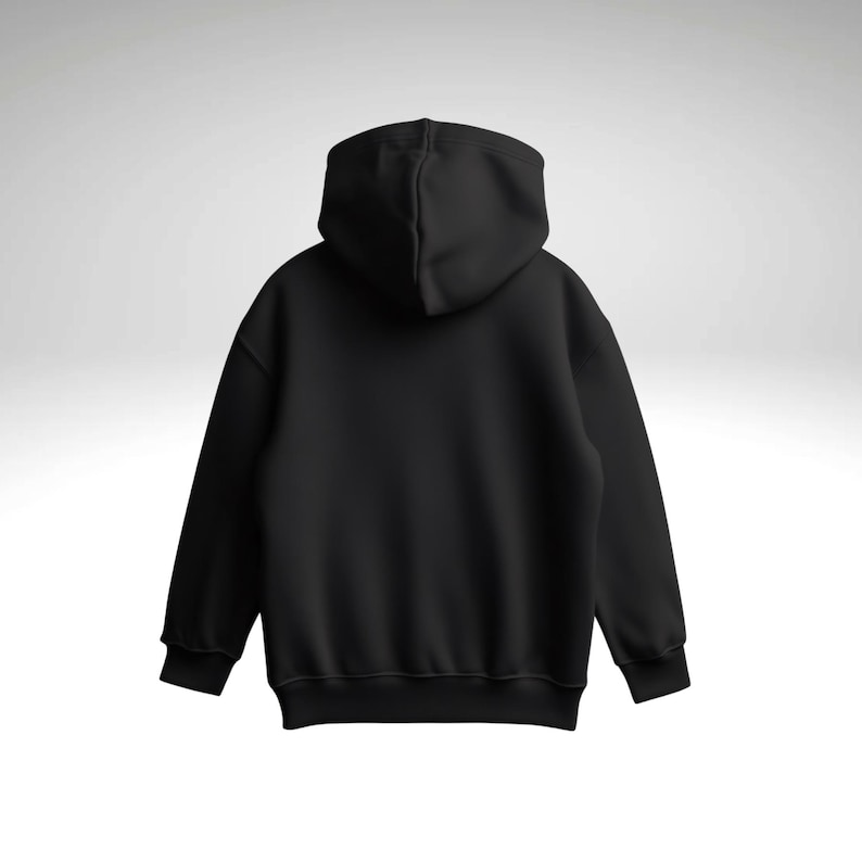 May include: A black hoodie, viewed from the back, featuring a hood and long sleeves. The image highlights the garment's shape and design. The material appears to be soft and comfortable, suitable for casual wear.