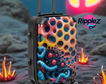 May include: A black rolling suitcase with a colorful, abstract design featuring orange, blue, and red patterns. The suitcase has a retractable handle and wheels. The word "Ripplez" is printed on the side.