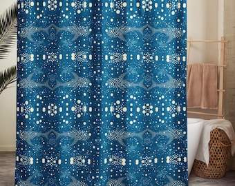May include: A blue shower curtain with a repeating pattern of white dots and stylized shapes. The design creates a textured, layered effect, suitable for bathroom decor. The curtain is hanging in a bathroom setting.