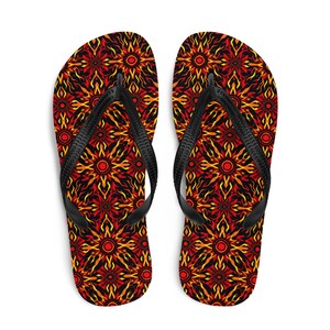May include: A pair of black flip-flops with a red, orange, and yellow flame-like pattern.