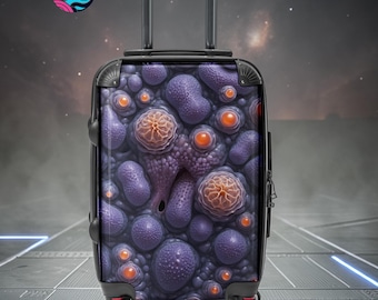 May include: A black rolling suitcase with a unique purple and orange pattern. The design features a textured, organic pattern with various shapes and sizes. The suitcase has a retractable handle and four wheels.