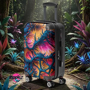 May include: A black rolling suitcase with a vibrant, abstract design in shades of blue, orange, and pink. The suitcase has a retractable handle and four wheels. The word "Ripplez" is visible on the bottom left.