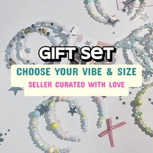 May include: Several beaded bracelets in pastel shades, featuring star and pearl details. The image displays the text "GIFT SET", "CHOOSE YOUR VIBE & SIZE", and "SELLER CURATED WITH LOVE".