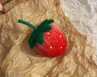 Handmade wool felt strawberry — a bright red, adorably soft needle-felted plush toy