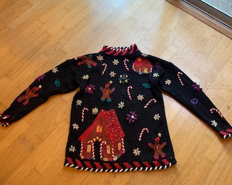 Vintage zwarte kersttrui uit de jaren 90 met peperkoekhuisje en peperkoekmannetje, maat M, "DBL 1995", geborduurd 3D-effect.