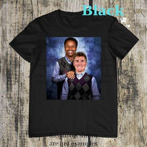 May include: Black t-shirt featuring a photo of two men wearing argyle vests over button-down shirts. The word "Black" is printed in turquoise at the top. The text "the photos shown are just examples" is at the bottom.