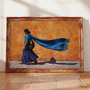 May include: A framed oil painting depicting a person walking in profile against a textured orange wall. The figure wears a blue top and a long blue skirt, with a long blue scarf trailing behind in the wind. The painting is in a decorative wood frame.